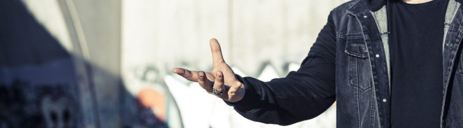 man-throwing-aerosol-can-mid-air